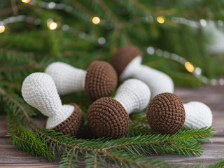 Knitted mushrooms. Concept. Stylization. Needlework. Environmentally friendly toys for children to develop fine motor skills. Hand made toys. 