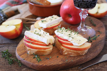 Appetizer. Apples and Camembert cheese bread toast and red wine. Healthy savory sandwich