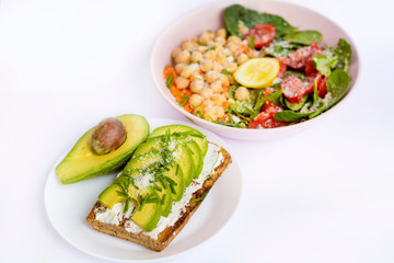 Avocado Salad with Cherry Tomatoes and Baby Spinach and Sandwich .Healthy Food