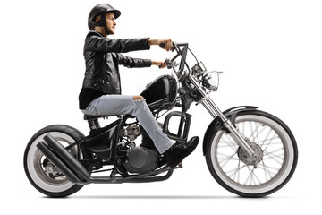 Fototapeta na wymiar Biker riding a custom chopper motorbike