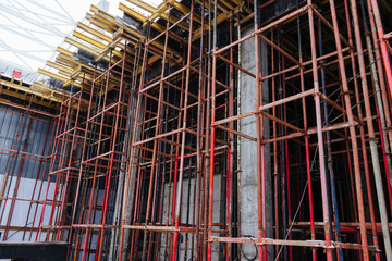 a grid of metal rods, the frame of the building
