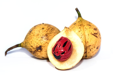 Fresh nutmeg isolated on white background