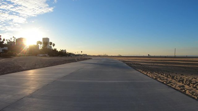 Riding towards sunrise on the Santa Monica Beach bike path in Los Angeles County, California.