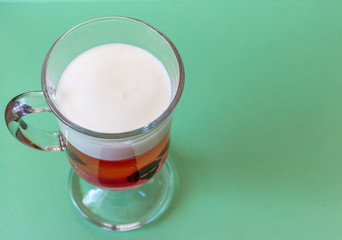 Multi-colored jelly and yogurt with the blackberries in a glass dessert bowl. Gelatin dessert for children. Delicious healthy food.
