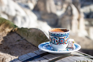 Cup with traditional Turkish coffee on a background of a valley in Cappadocia, Turkey