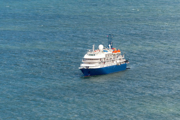 Fototapeta na wymiar Blue cruise ship at sea. Passenger vessel. 