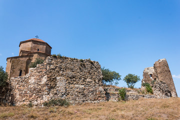 Fototapeta na wymiar The ruined wall around the old temple