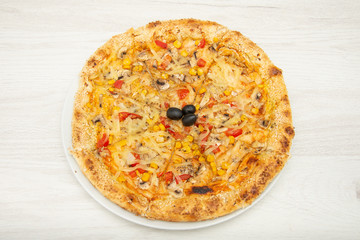 A healthy and delicious vegetable pizza made with cheddar and mozzarella cheeses
