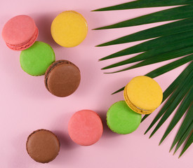Close-Up Of Multi Colored Macaroons Over Pink Background