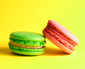 colored macaroon on a yellow background