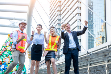 Obraz premium Cheerful Business people Celebrating Success Outdoors,Team building celebrate success good teamwork,Successful business people concept.
