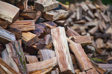 Natural background with huge pile of firewoods close up