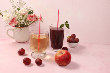 Fruit cider, juices or fruit drinks in glasses and ingredients on a sunny table. The concept of a detox diet and weight loss, healthy and natural nutrition, bar. Healthy breakfast, lifestyle