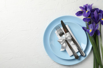 Easter table setting on white background, top view