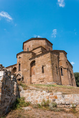 Part of the fence of the Georgian temple against the sky