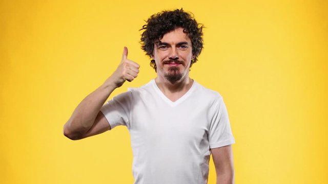 White t-shirt on a young man template isolated on yellow background