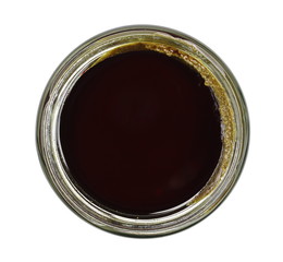 Pumpkin seed butter, creamy paste in glass jar isolated on white background, top view