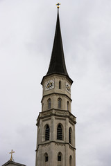 Fototapeta na wymiar Beautiful white tower of an old stone church in Vienna, Austria.