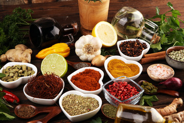 Spices and herbs on table. Food and cuisine ingredients with oil and vinegar