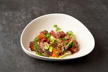 Smoked duck meat with baked pumpkin and lettuce leaves