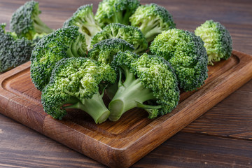  A lot of broccoli for diet and healthy eating. Fresh green broccoli on a   table.Broccoli...