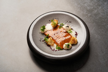 Baked salmon fish fillet with chinese cauliflower and cream sauce