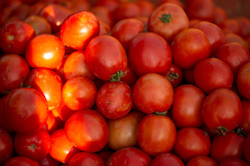 Delicious red tomatoes. Summer tray market agriculture farm full of organic vegetables It can be used as background
