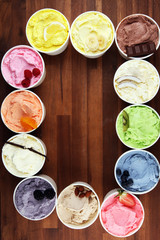 Various of ice cream flavor whit fresh blueberry, strawberry, kiwi, lemon, vanilla setup on rustic background . Summer and Sweet cold ice cream
