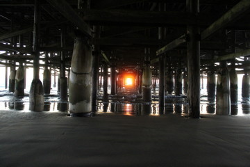 sunset under pier
