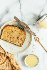 Salted honey butter on toast, marble background