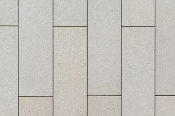 wall of rectangular slabs of light limestone
