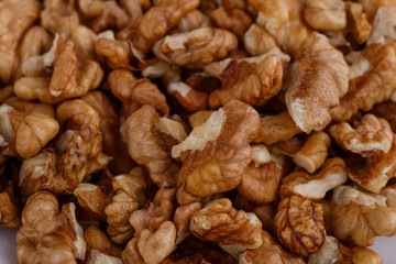 Walnuts shelled. Peeled Raw Walnuts. Fresh organic Nuts. Raw nuts. Many delicious Walnuts as a food background.