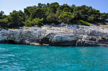 Mediterranean sea coast landscape, blue clear sky and sea, white rocks.