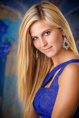 Naklejka premium Blond Hair Blue Dress Woman in a Studio