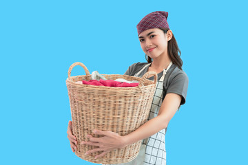 Young woman holding basket clothing laundry blue background