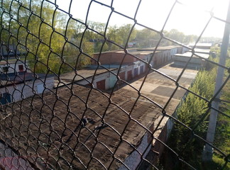 brick Russian garages behind bars