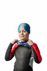 Young guy in a wetsuit, fins, glasses and a hat. Diving training - 326513971