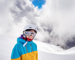 Snowboarder woman in mountains