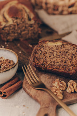 Homemade tasty banana cake sliced on a table close-up. Horizontal photo.