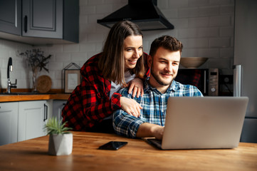 Young couple in love websurfing together