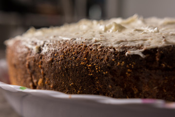 biscuit cake with vanilla cream close-up on a rustic table