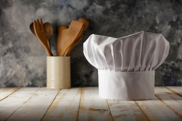 Cook hat on desk and free space for your decoration 