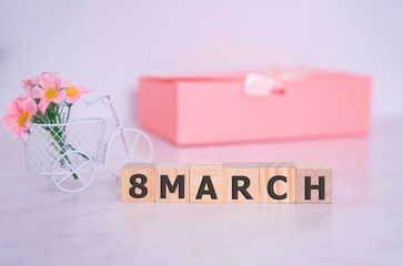 Women's day March 8 with wooden block calendar and flowers. Calendar with the date of March 8 - Holiday flowers