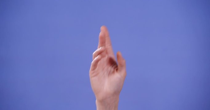 Woman showing U letter on blue background, closeup. Sign language