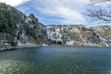 Mountain lake with snow and ice, Vosges, France