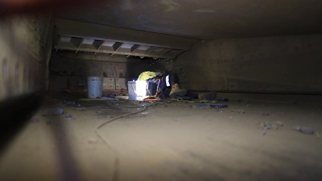 Footage of construction miner  boilermaker maintenance worker commencing chute liner repairing in confined spaces at construction  site, Perth, Australia
