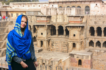 Tourists is exploring ancient Indian step well, Architecture of stairs at Abhaneri baori stepwell in Jaipur, Rajasthan india.