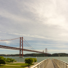 Fototapeta na wymiar The 25th of April bridge in Lisbon, Portugal. Square format.