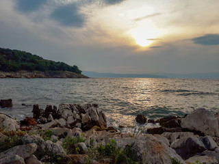 Fototapeta na wymiar Sunset at adriatic sea on Kijac beach on Krk island, Croatia.