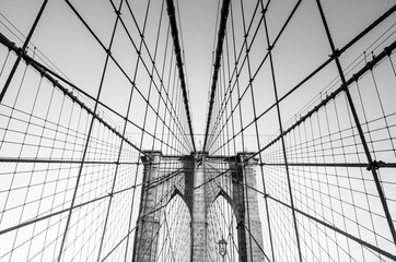The web of cables of Brooklyn bridge in black and white, New York, USA